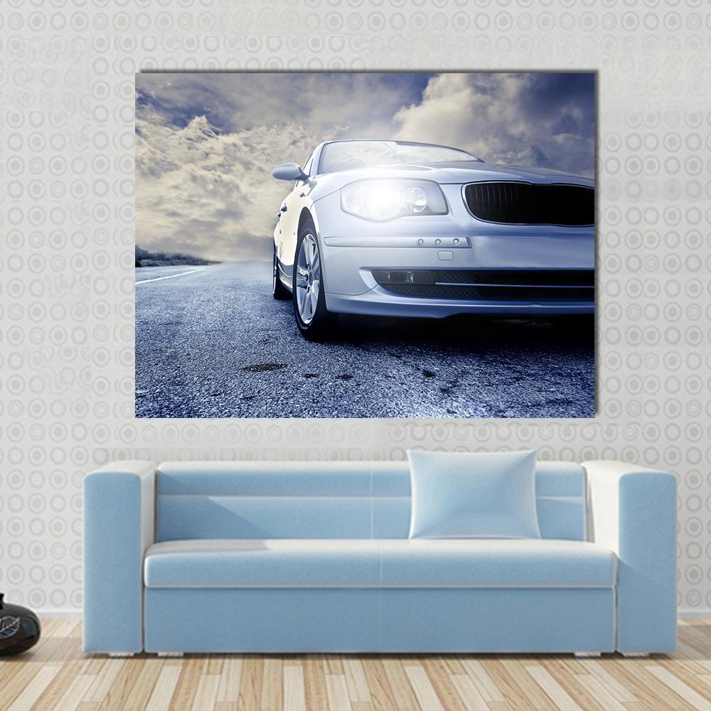 Car on Road Canvas Wall Art in gray, silver and blue, single panel hung on a wall