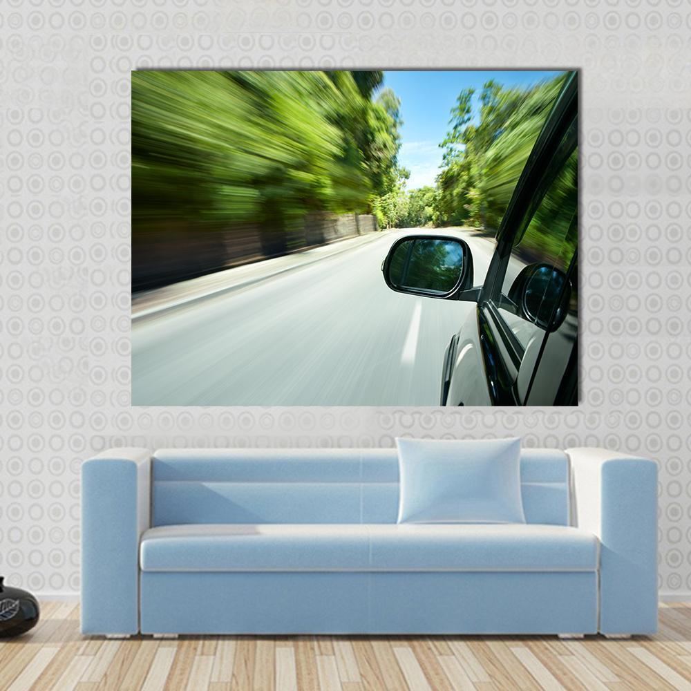 Car Speeding on Road Canvas Wall Art in black, gray and green, single panel hung on a wall