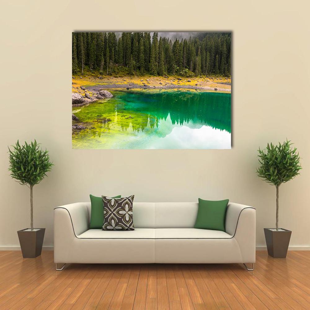 Carezza Lake Reflection Canvas Wall Art in brown, yellow and green, single panel hung on a wall