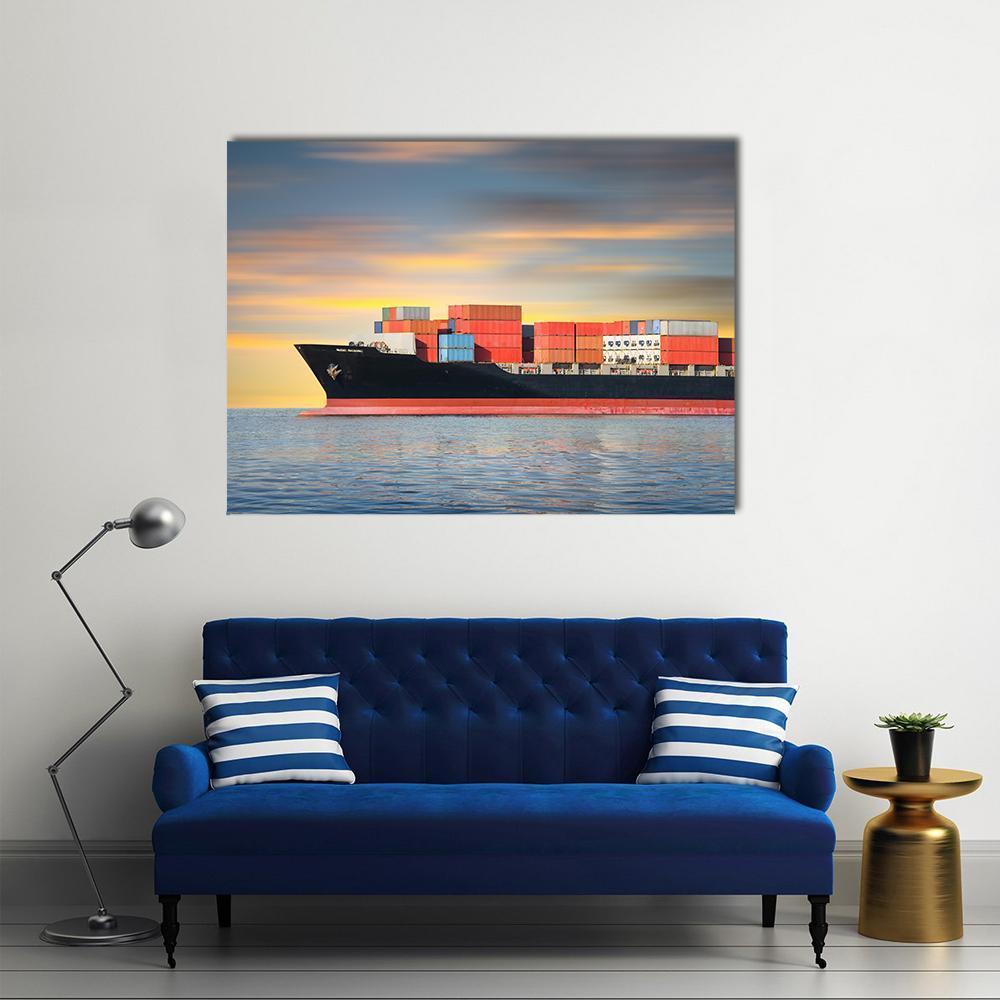 Cargo Ship at Sea Canvas Wall Art in gray, orange and blue, single panel hung on a wall
