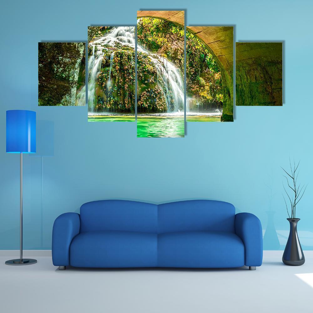 Spring Cascade at Orbaneja Del Castillo Canvas Wall Art in white, brown and green, 5 panel Star layout hung on a wall