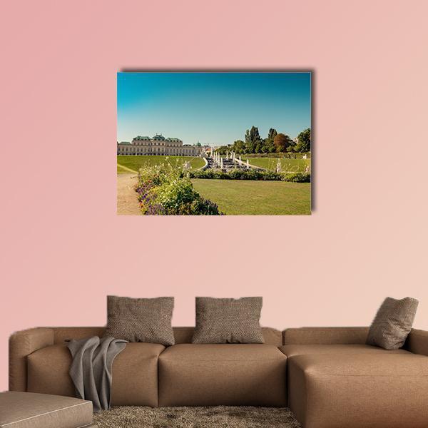 Fountain at Belvedere Garden Canvas Wall Art in yellow, green and blue, single panel hung on a wall