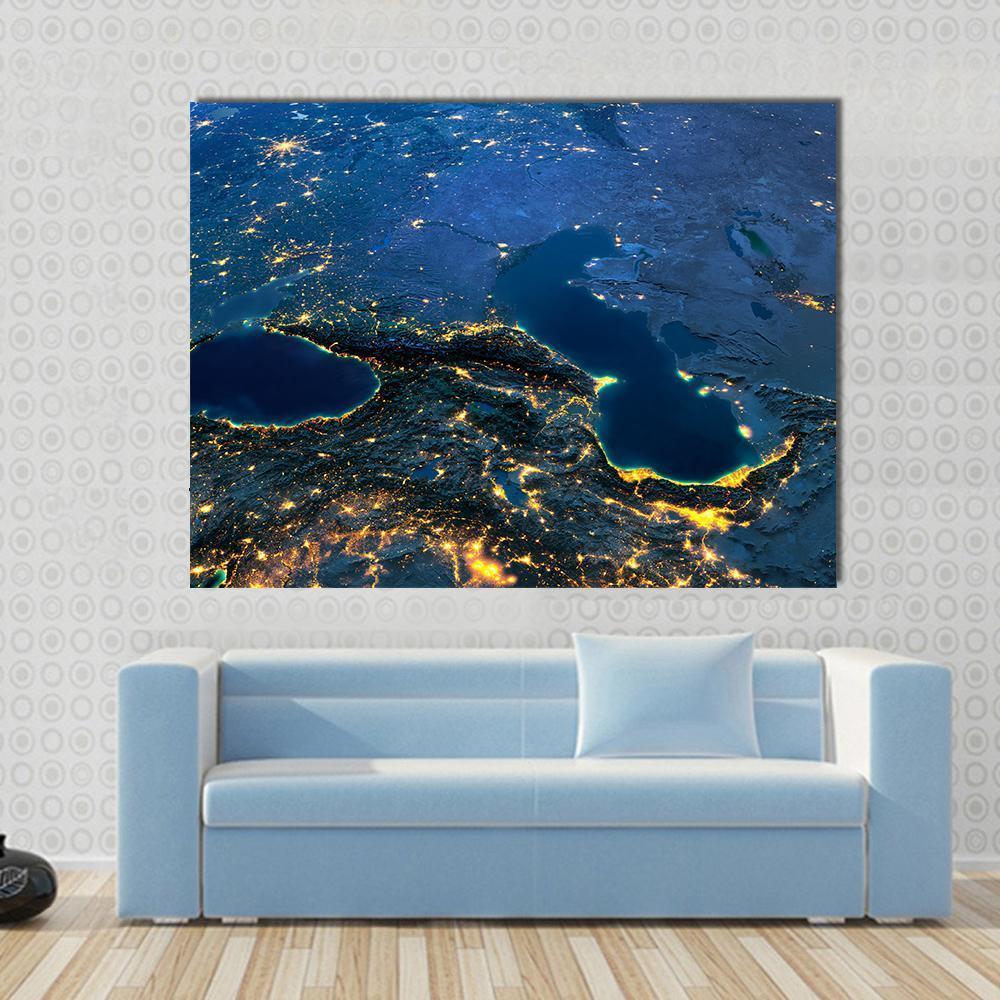 Caspian Sea from Space Canvas Wall Art in black, yellow and blue, single panel hung on a wall