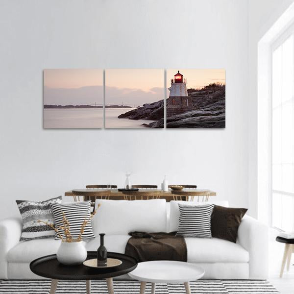 Castle Hill Lighthouse Panoramic Canvas Wall Art in white, gray and pink, hung on a wall