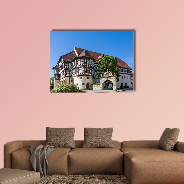 Castle in Bad Urach Canvas Wall Art in white, brown and blue, single panel hung on a wall