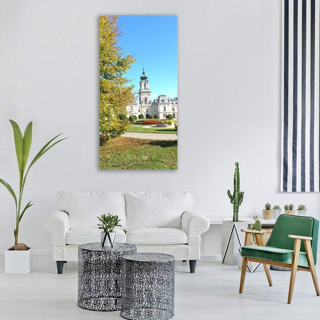 Castle Tower and Autumn Garden Vertical Canvas Wall Art in white, green and blue, single vertical panel hung on a wall