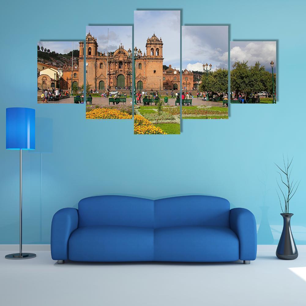 Peruvian Cathedral Basilica Plaza Canvas Wall Art in brown, green and blue, 5 panel Star layout hung on a wall