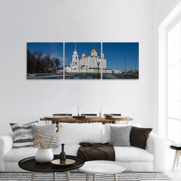 White Russian Cathedral with Golden Domes Panoramic Canvas Wall Art in white, gold and blue, hung on a wall