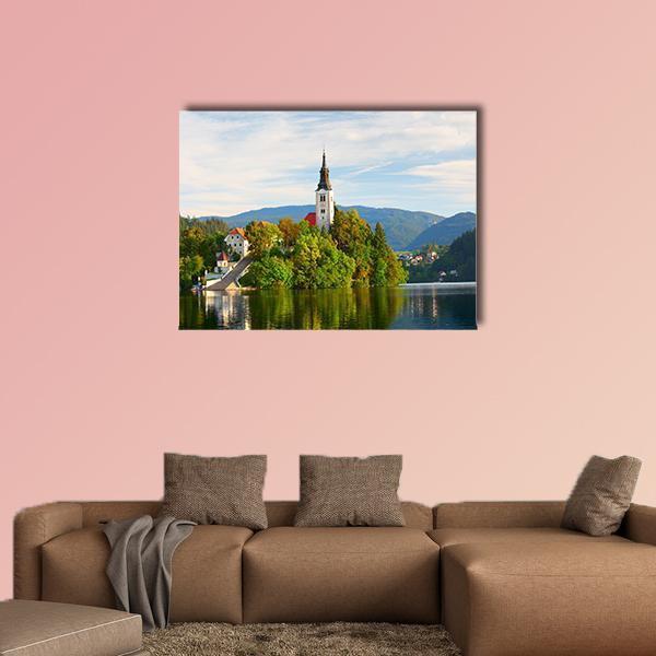 Church on Bled Lake Canvas Wall Art in white, green and blue, single panel hung on a wall