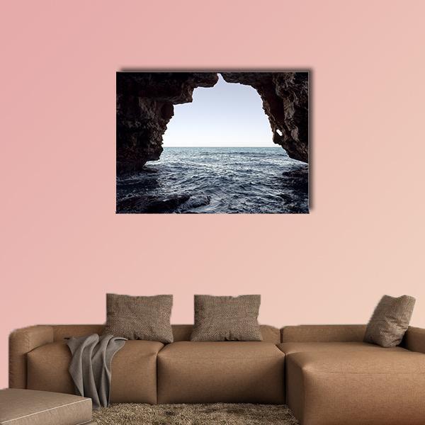 Moraig Beach Sea Cave Canvas Wall Art in black, white and blue, single panel hung on a wall