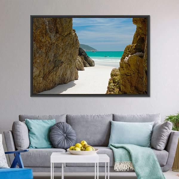 Beach Cave Framed by Rocks Canvas Wall Art in white, brown and blue, framed canvas, product view on a white background