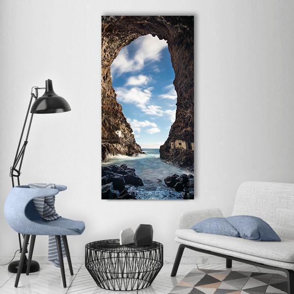 Sea Cave Overlooking Bay Vertical Canvas Wall Art in white, brown and blue, single vertical panel hung on a wall