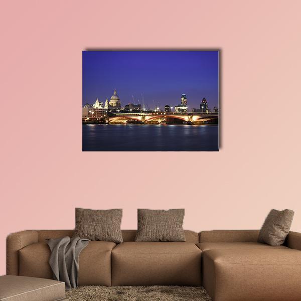 Central London at Night Canvas Wall Art in black, yellow and blue, single panel hung on a wall