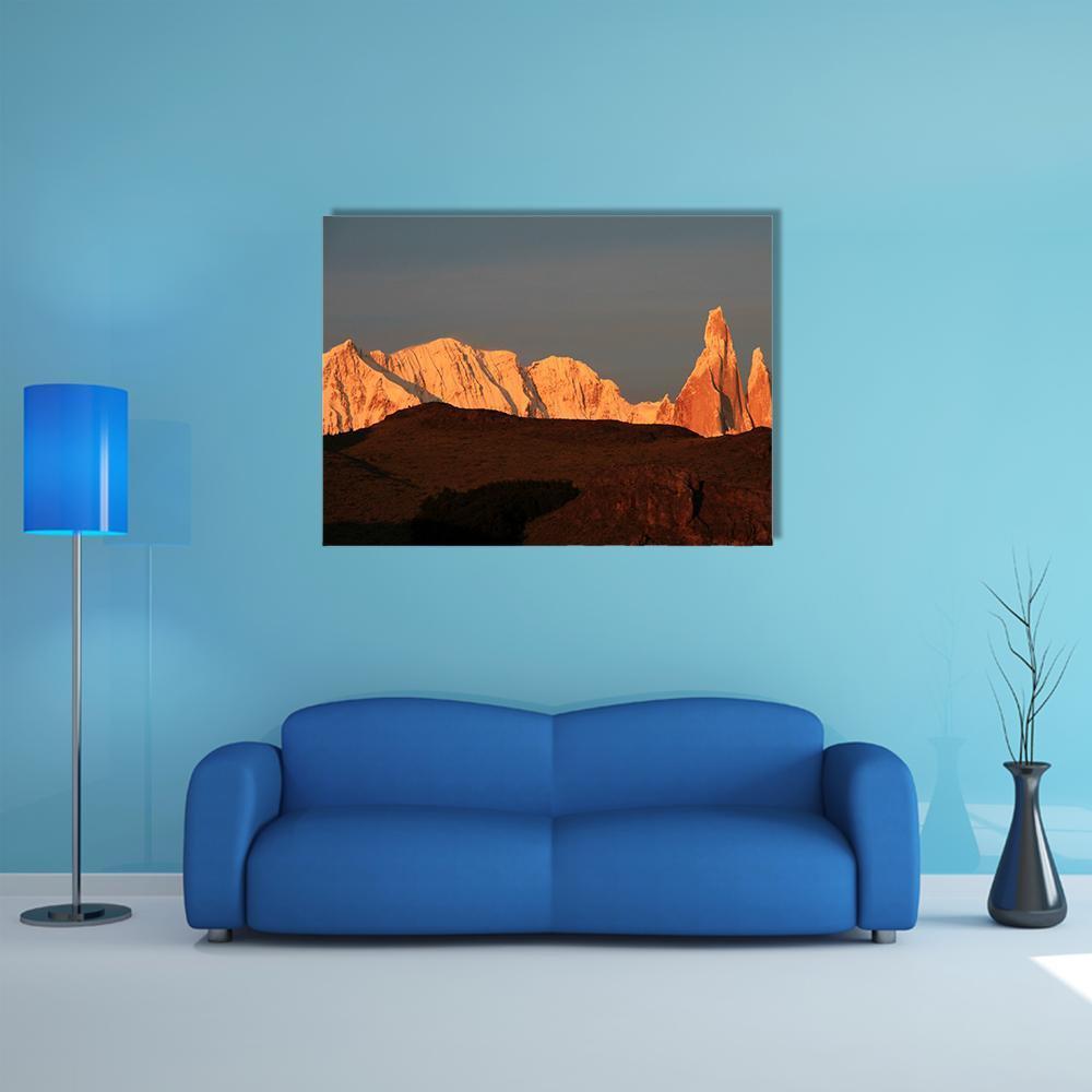 Cerro Torre at Sunrise Canvas Wall Art in black, gray and orange, single panel hung on a wall