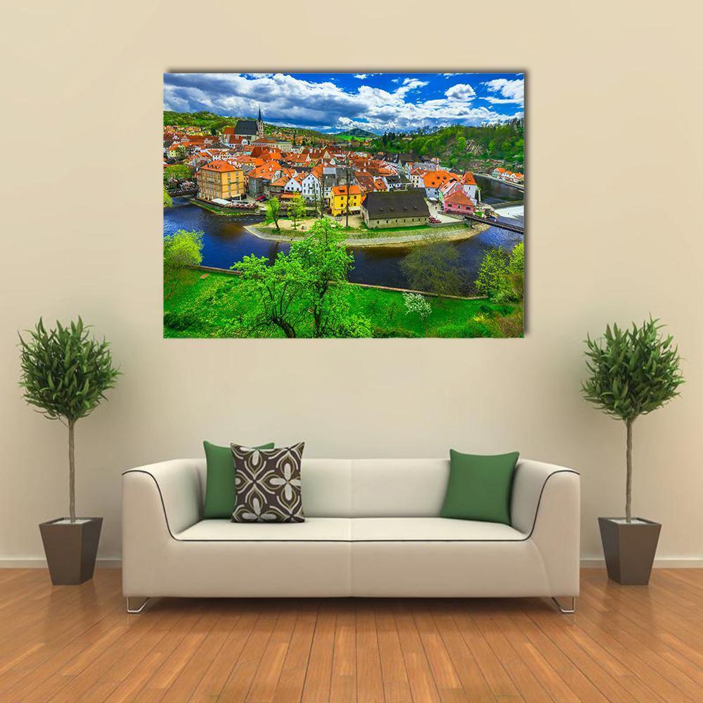 Cesky Krumlov Aerial Town View Canvas Wall Art in orange, green and blue, single panel hung on a wall