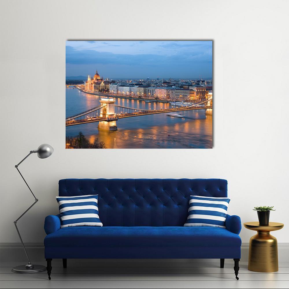 Széchenyi Chain Bridge on the Danube at Twilight Canvas Wall Art in gold, orange and blue, single panel hung on a wall
