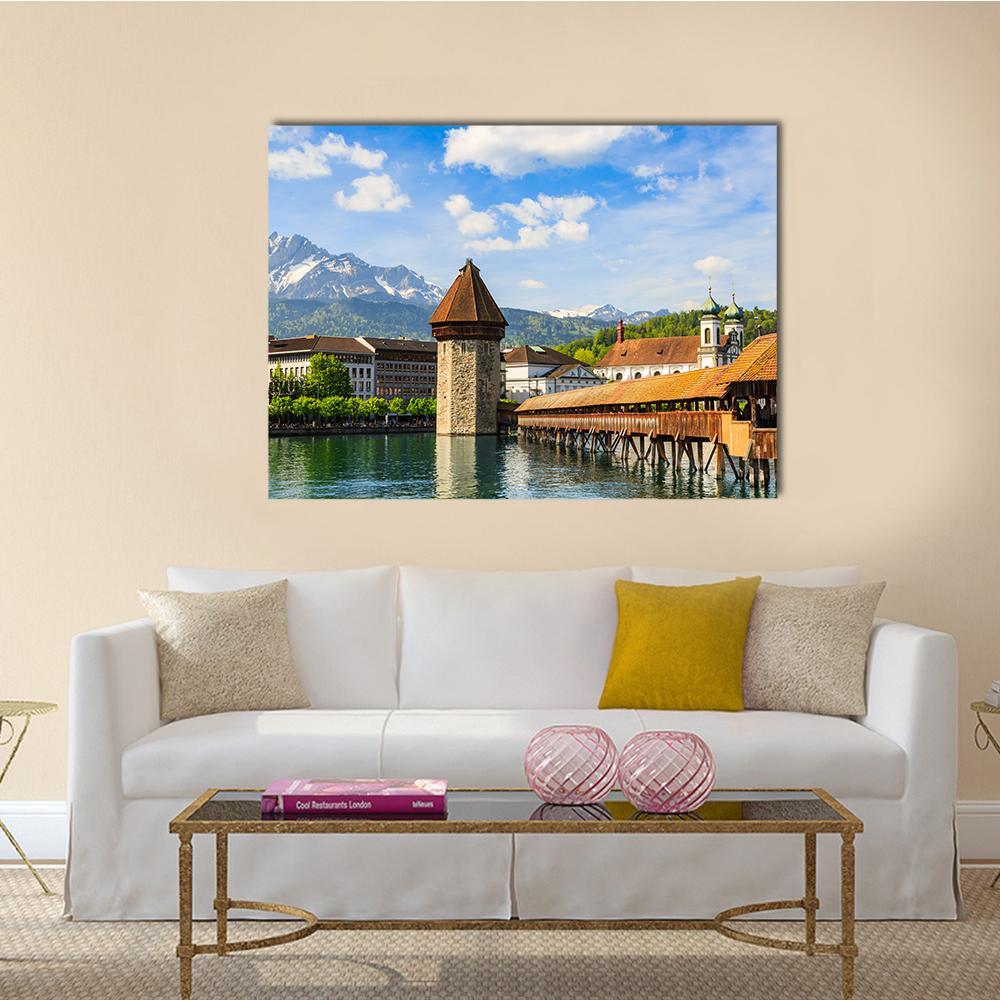 Chapel Bridge and Reuss River Canvas Wall Art in brown, green and blue, single panel hung on a wall