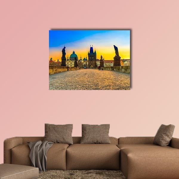 Historic Stone Bridge at Sunset Canvas Wall Art in orange, yellow and blue, single panel hung on a wall
