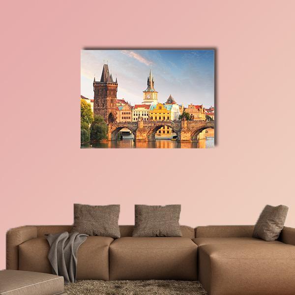 Charles Bridge at Sunset, Prague Canvas Wall Art in brown, orange and blue, single panel hung on a wall