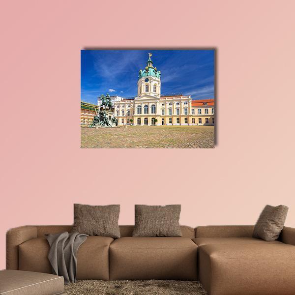 Charlottenburg Palace Courtyard with Equestrian Statue Canvas Wall Art in beige, yellow and blue, single panel hung on a wall