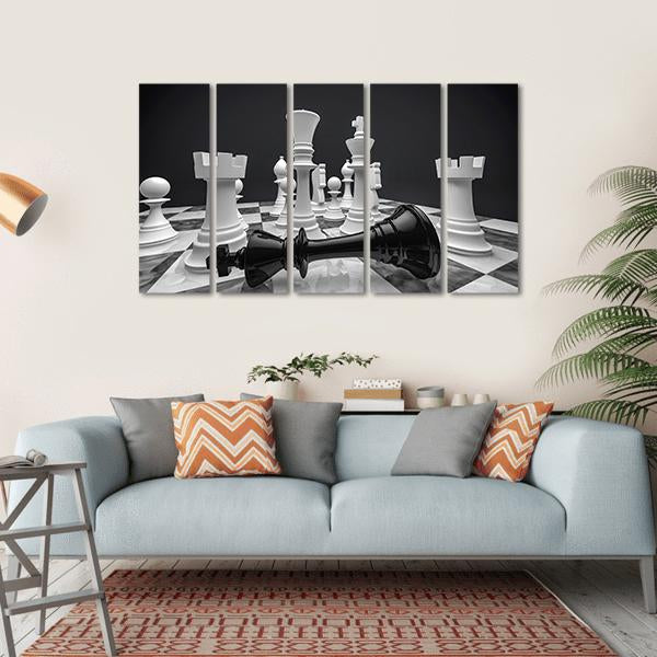 Fallen Black King on Chessboard Canvas Wall Art in black, white and gray, hung on a wall