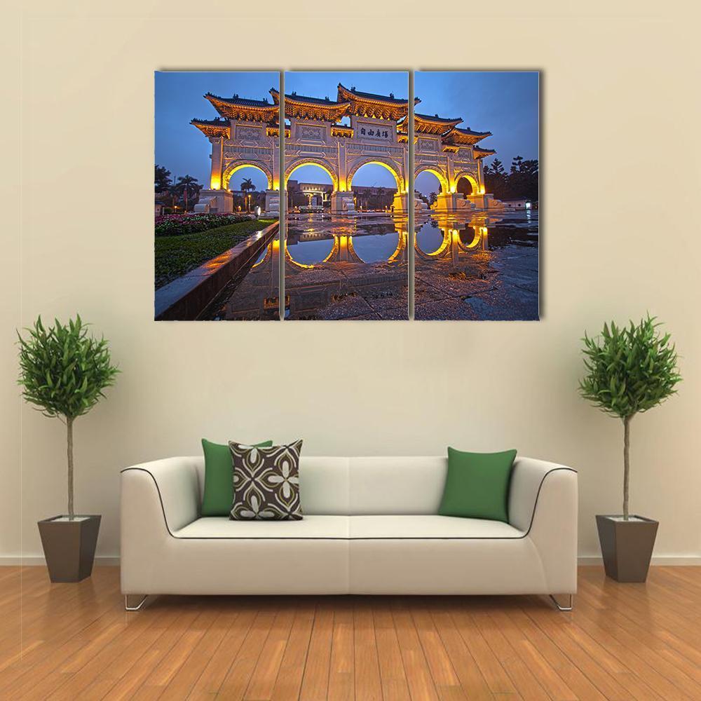 Chiang Kai Shek Memorial Hall at Night Canvas Wall Art in gold, yellow and blue, 3 panel horizontal set hung on a wall