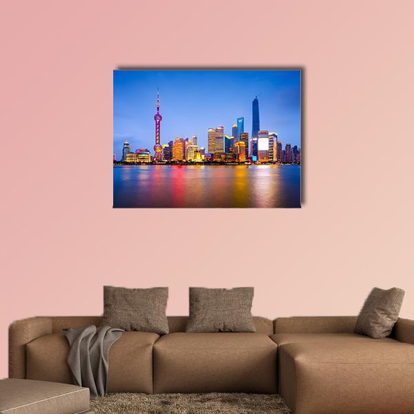 Shanghai Skyline at Dusk Canvas Wall Art in orange, yellow and blue, single panel hung on a wall