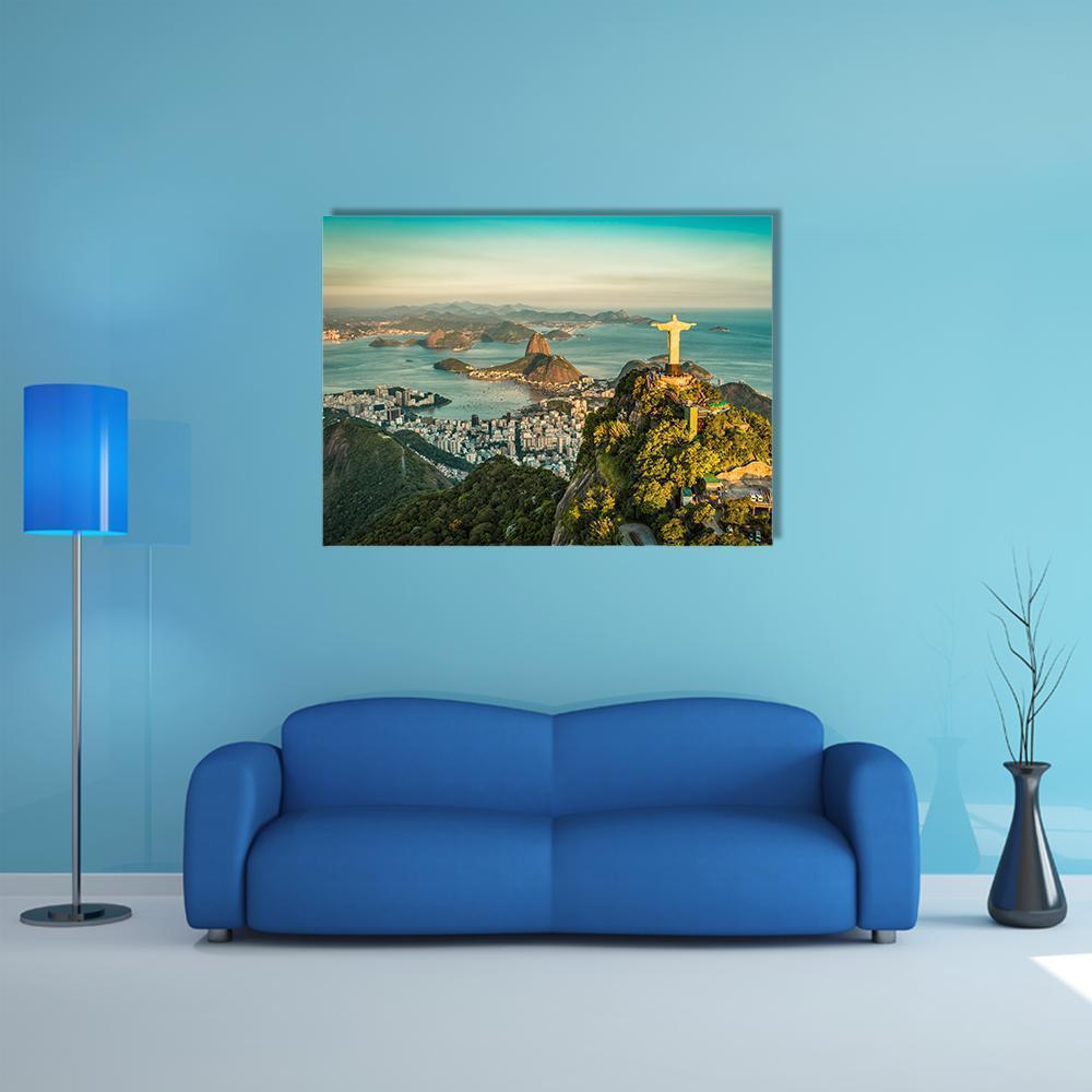 Christ the Redeemer Over Botafogo Bay Canvas Wall Art in yellow, green and blue, single panel hung on a wall