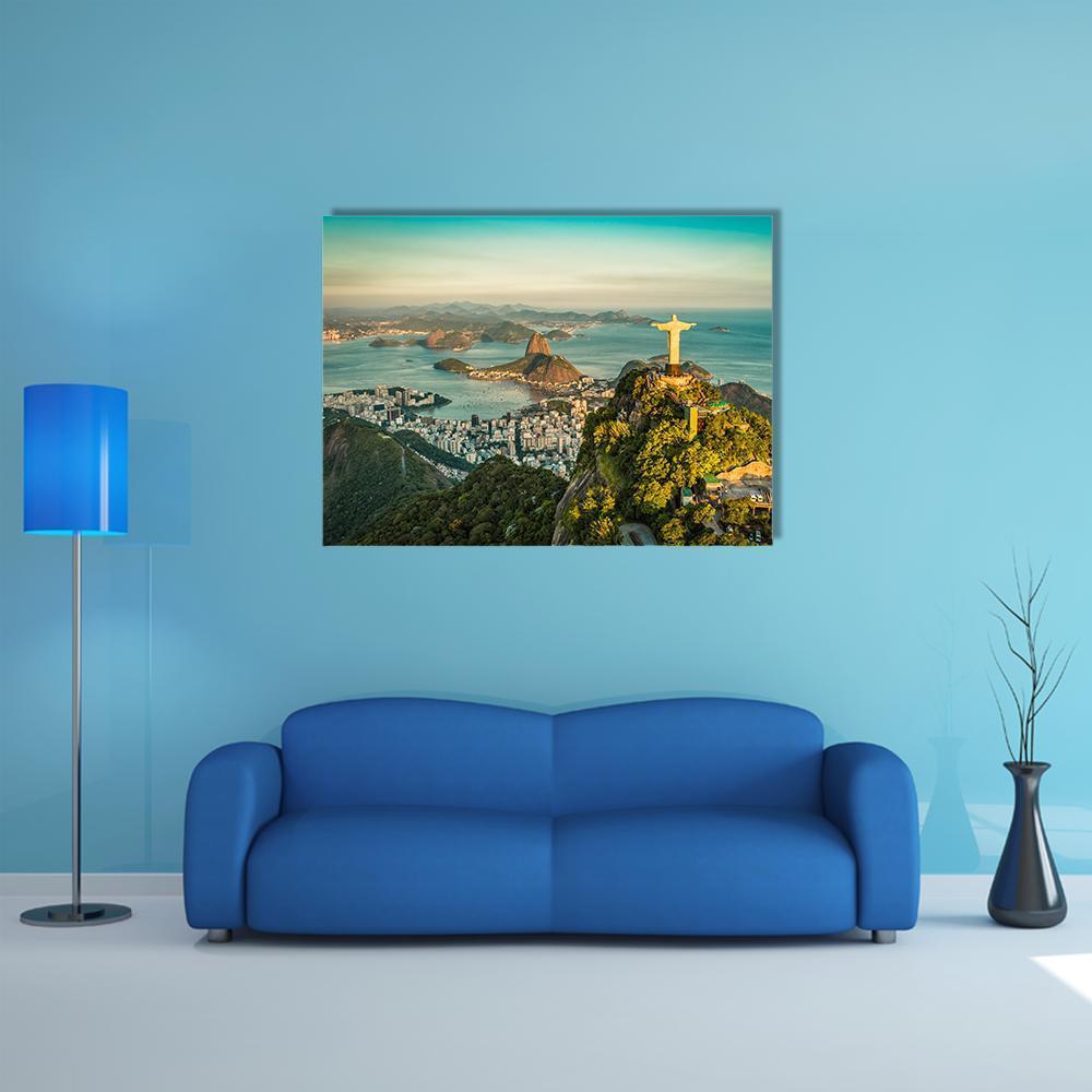 Christ the Redeemer Over Botafogo Bay Canvas Wall Art in yellow, green and blue, single panel hung on a wall