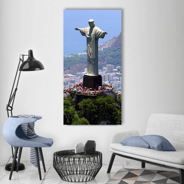 Christ the Redeemer Over Rio De Janeiro Vertical Canvas Wall Art in gray, green and blue, single vertical panel hung on a wall