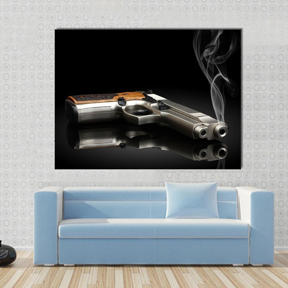 Chromed Handgun Canvas Wall Art in black and silver, single panel hung on a wall