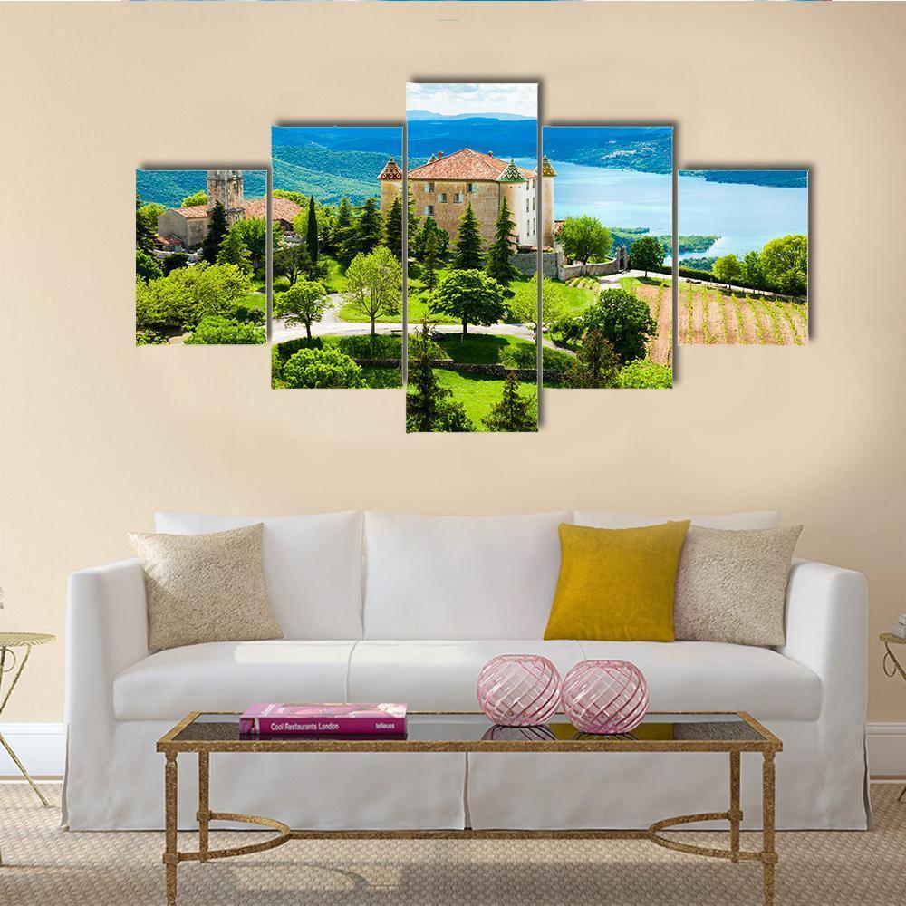 Church Tower Over Lake and Rolling Hills Canvas Wall Art in green and blue, 5 panel Star layout hung on a wall