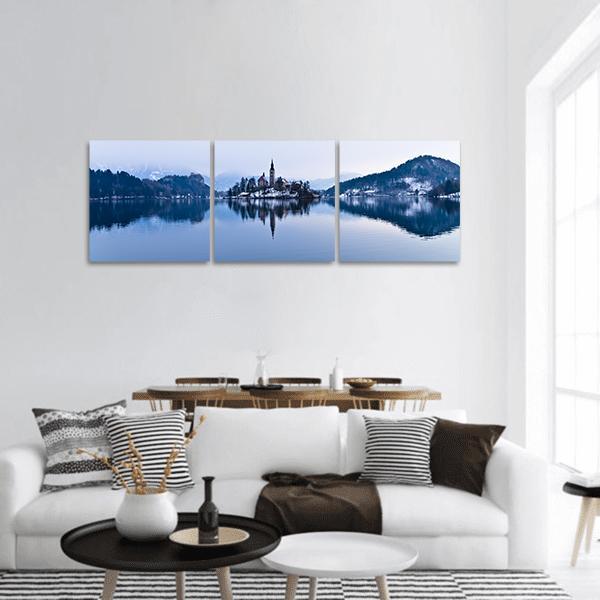 Lake Bled Island Church Panoramic Canvas Wall Art in white and blue, hung on a wall