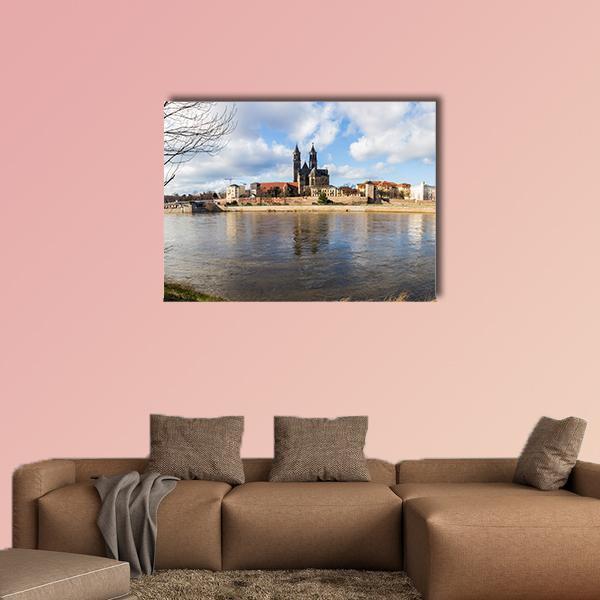 Magdeburg Church with River Reflections Canvas Wall Art in white, brown and blue, single panel hung on a wall