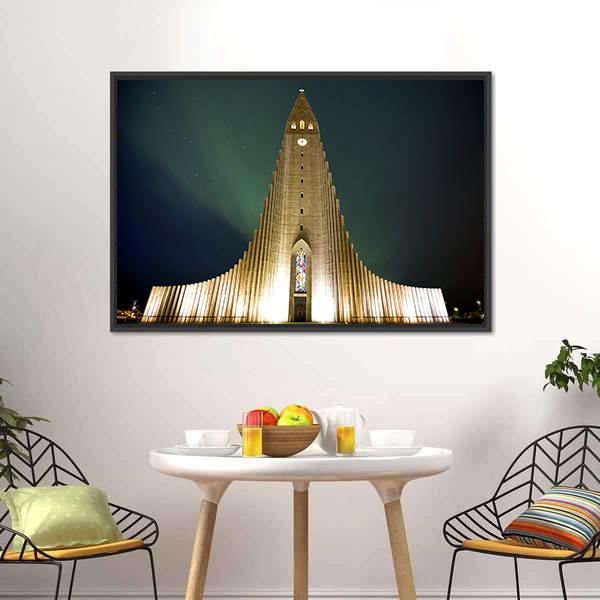 Hallgrímskirkja Church Under Northern Lights Canvas Wall Art in black, yellow and green, framed canvas, product view on a white background