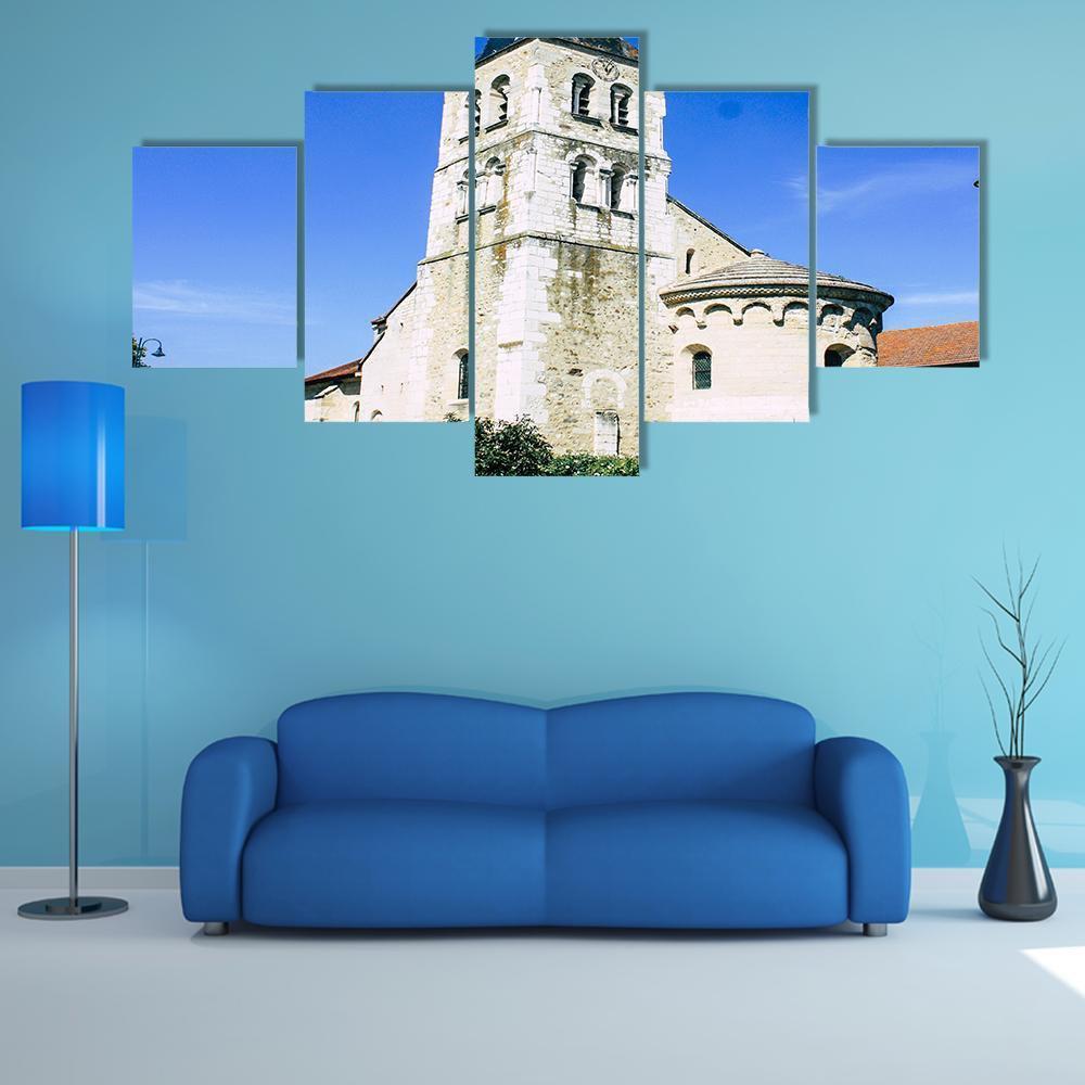 Historic Church with Steeple and Arched Windows Canvas Wall Art in white, beige and blue, 5 panel Star layout hung on a wall