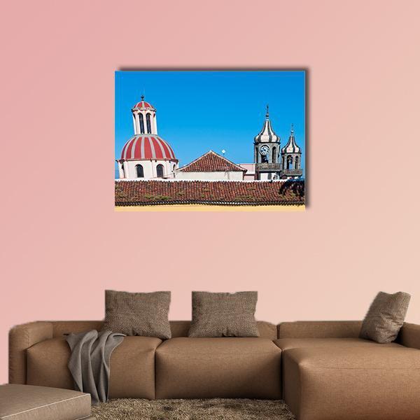 Church of La Concepcion Dome and Clock Tower Canvas Wall Art in white, red and blue, single panel hung on a wall