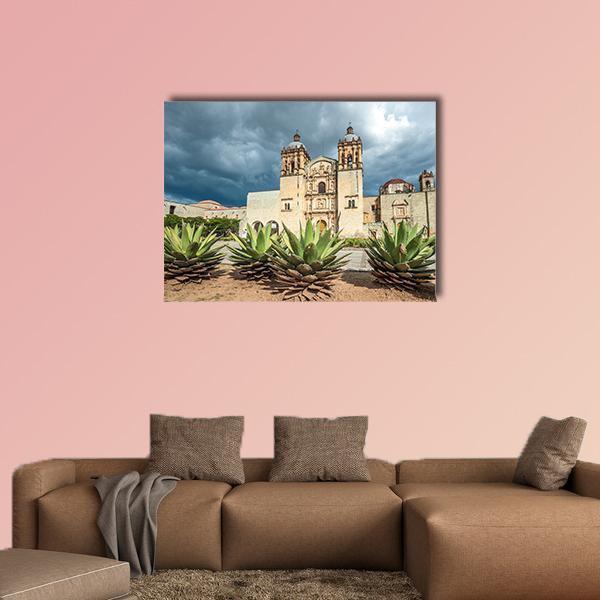 Santo Domingo Church Facade with Agave Canvas Wall Art in beige, green and blue, single panel hung on a wall