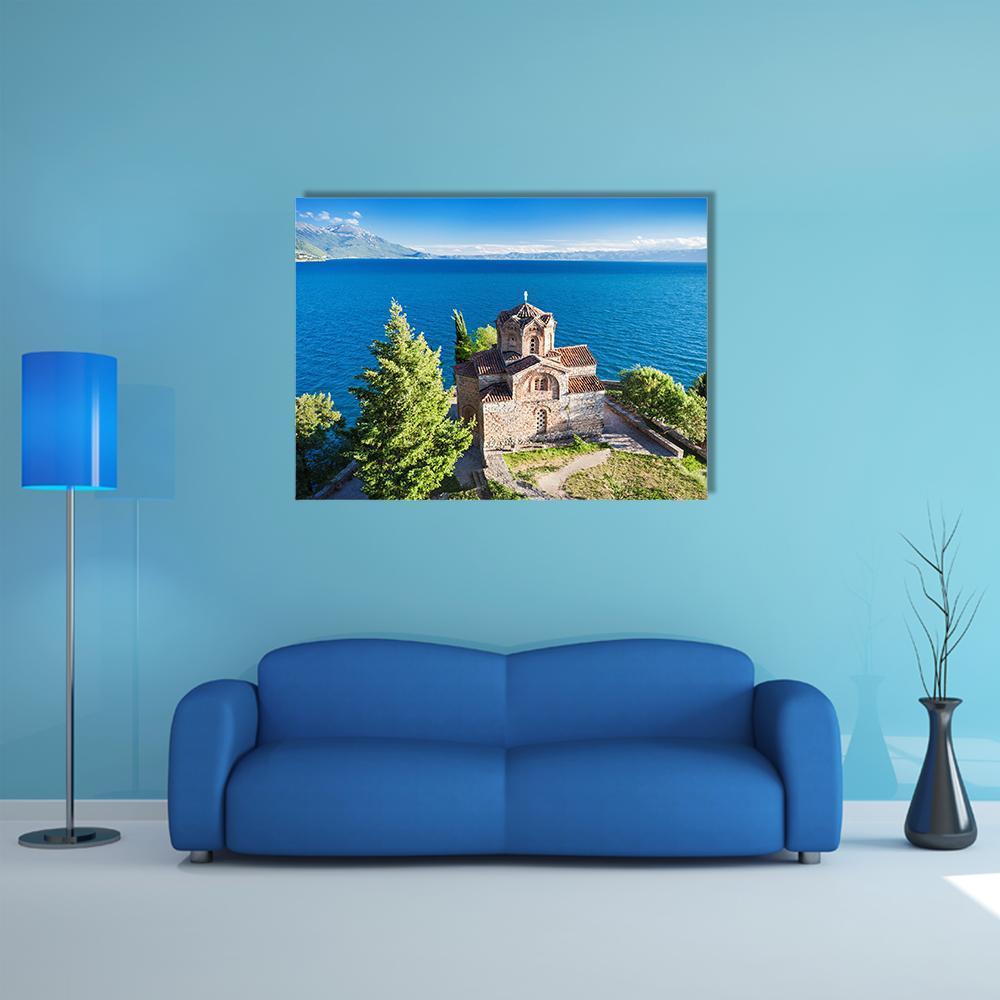 Church of St John Kaneo Canvas Wall Art in brown, green and blue, single panel hung on a wall