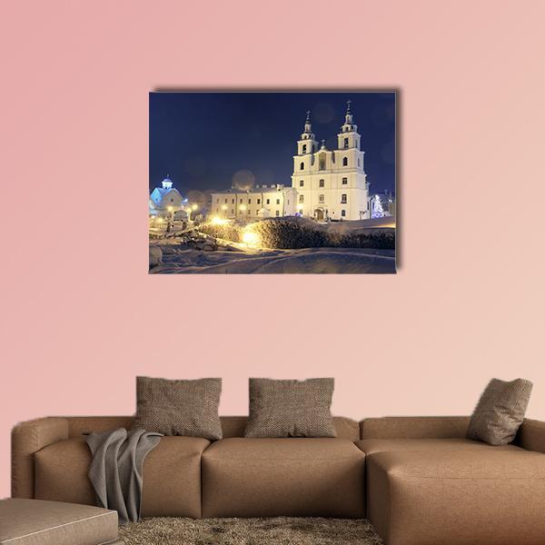 Church on Christmas Night Canvas Wall Art in white and blue, single panel hung on a wall