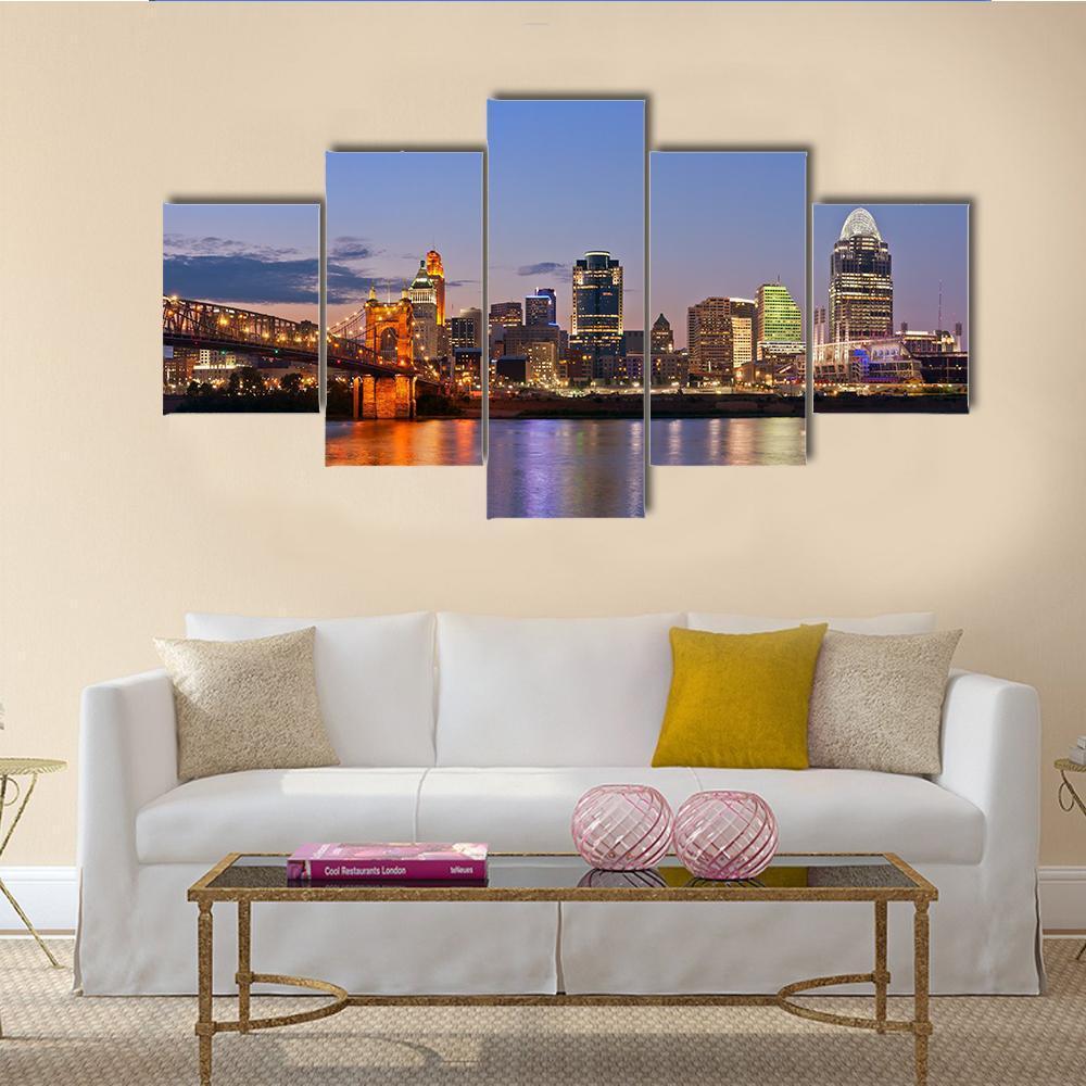 Cincinnati Skyline at Dusk Canvas Wall Art in orange, yellow and blue, 5 panel Star layout hung on a wall