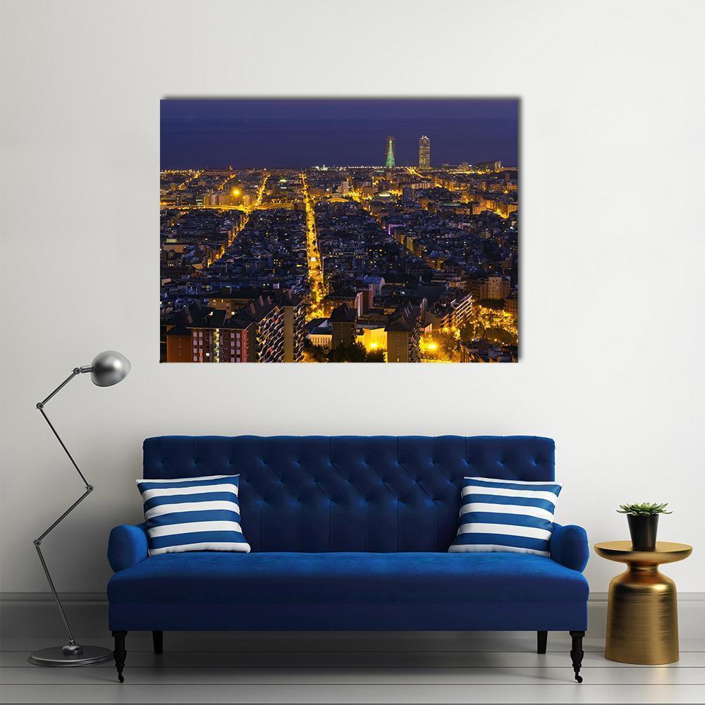 Barcelona Cityscape at Night Canvas Wall Art in black, yellow and blue, single panel hung on a wall