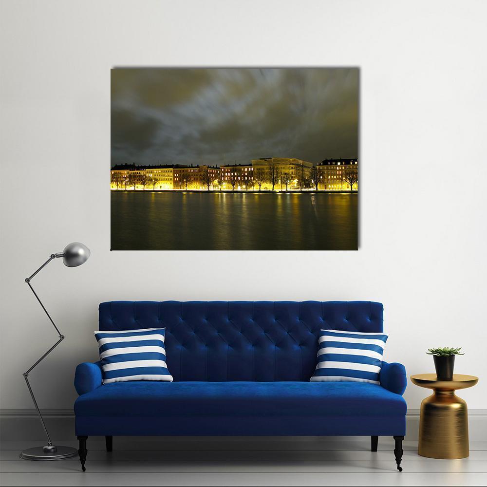Copenhagen Night Sky with Reflections Canvas Wall Art in black, gray and yellow, single panel hung on a wall