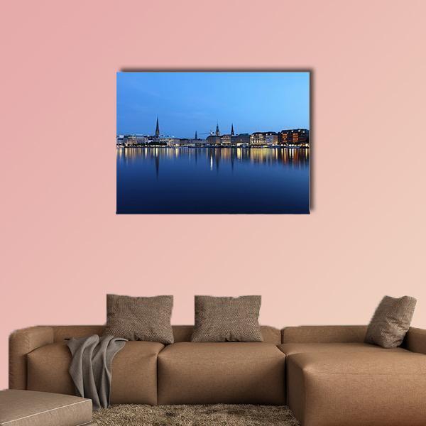 Hamburg Waterfront at Twilight Canvas Wall Art in blue and navy, single panel hung on a wall