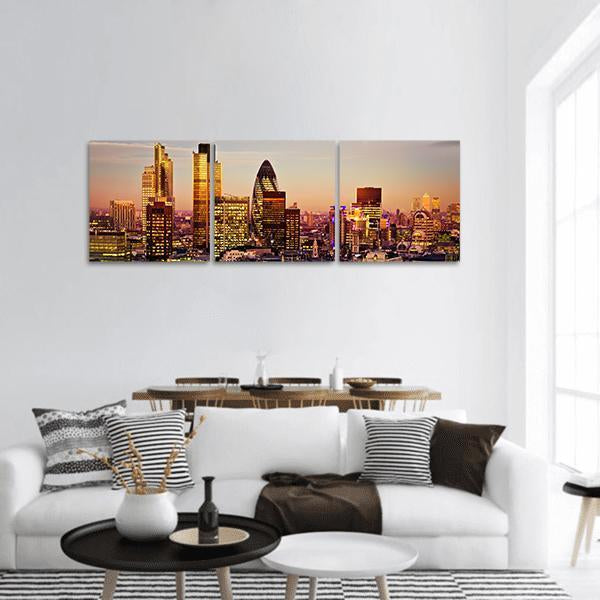 London Skyline at Dusk Panoramic Canvas Wall Art in gold, orange and yellow, hung on a wall
