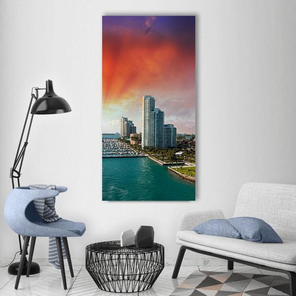Miami Skyline Over Turquoise Bay Vertical Canvas Wall Art in orange, blue and purple, single vertical panel hung on a wall