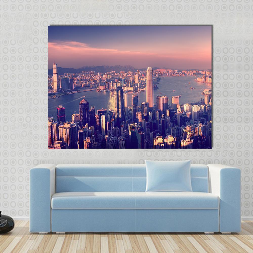 Hong Kong Skyline at Sunset Canvas Wall Art in blue, purple and pink, single panel hung on a wall