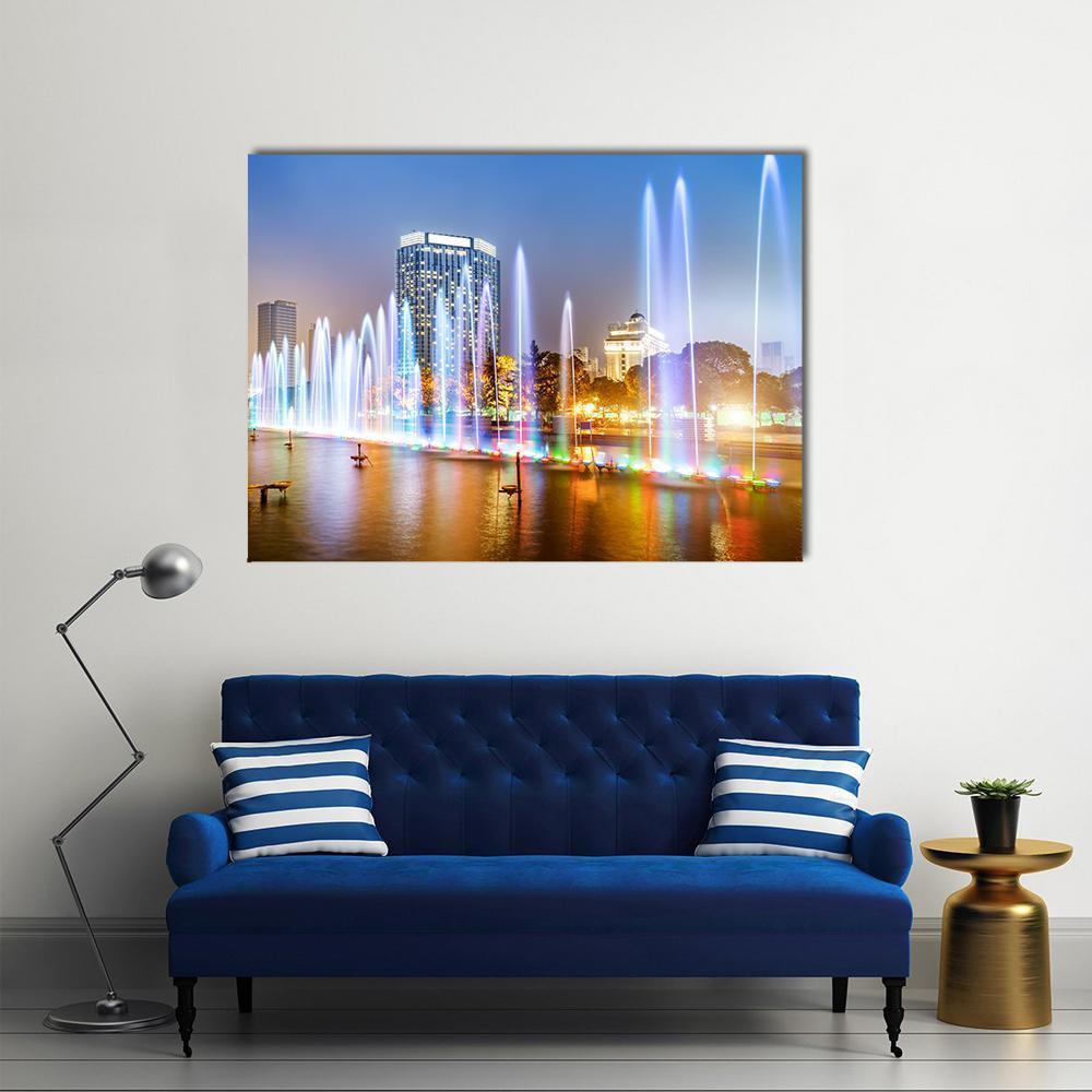 City Square Music Fountain at Night Canvas Wall Art in white, blue and multicolor, single panel hung on a wall