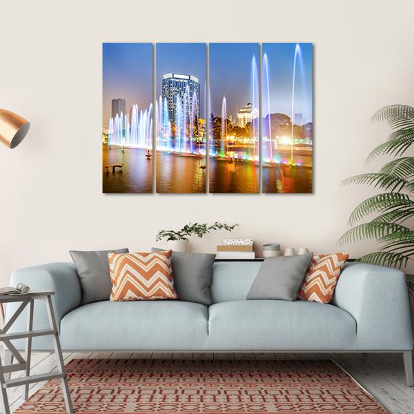 City Square Music Fountain at Night Canvas Wall Art in white, blue and multicolor, hung on a wall