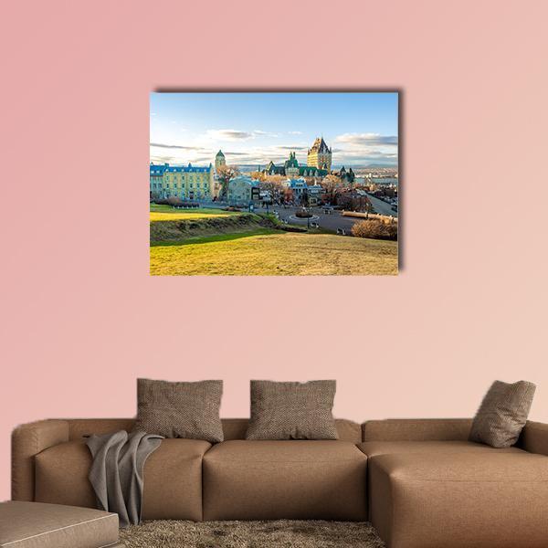 Quebec Cityscape with Rolling Hills Canvas Wall Art in yellow, green and blue, single panel hung on a wall